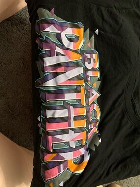 Marvel Black Short Sleeve Tee with Purple, Pink, Orange and Teal Graphic